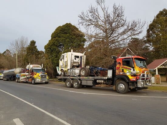 A bunch of towing truck in the road from Buchan Towing