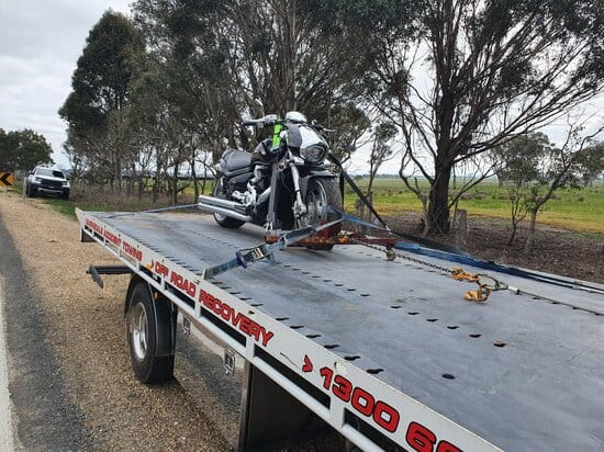 a motorcycle being towed in a truck