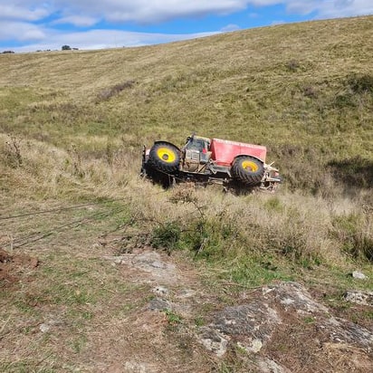 a vehicle stuck down the side of a hill waiting for off road recovery