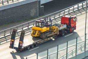 Bulldozer Towing services in the road